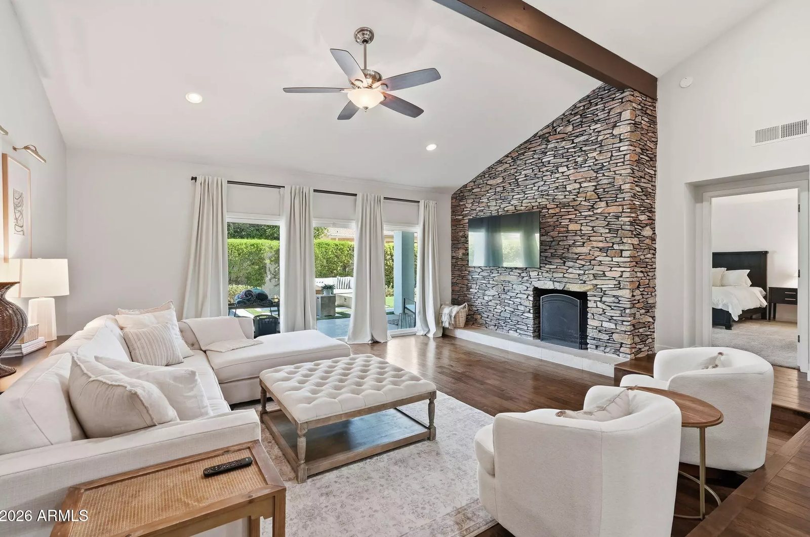 Family room with stone fireplace in a Scottsdale, Arizona brokerage listing