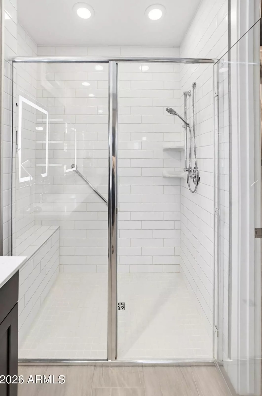 Tiled walk-in shower in a Surprise, Arizona brokerage listing