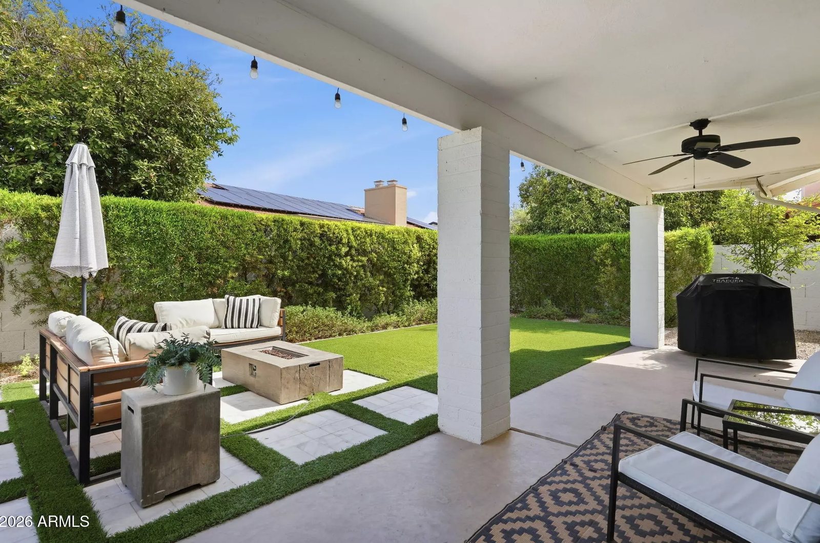 Covered patio with outdoor kitchen in a Scottsdale, Arizona brokerage listing