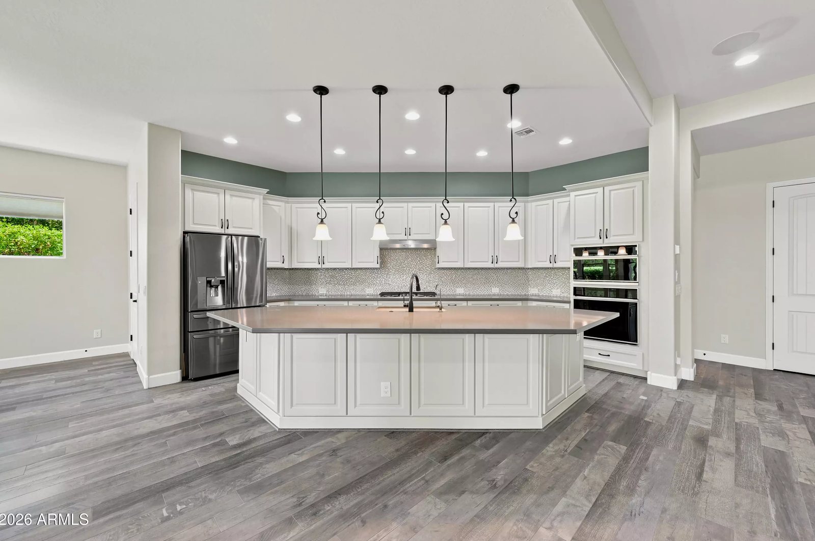 Kitchen with island and pendant lighting in a Litchfield Park, Arizona brokerage listing