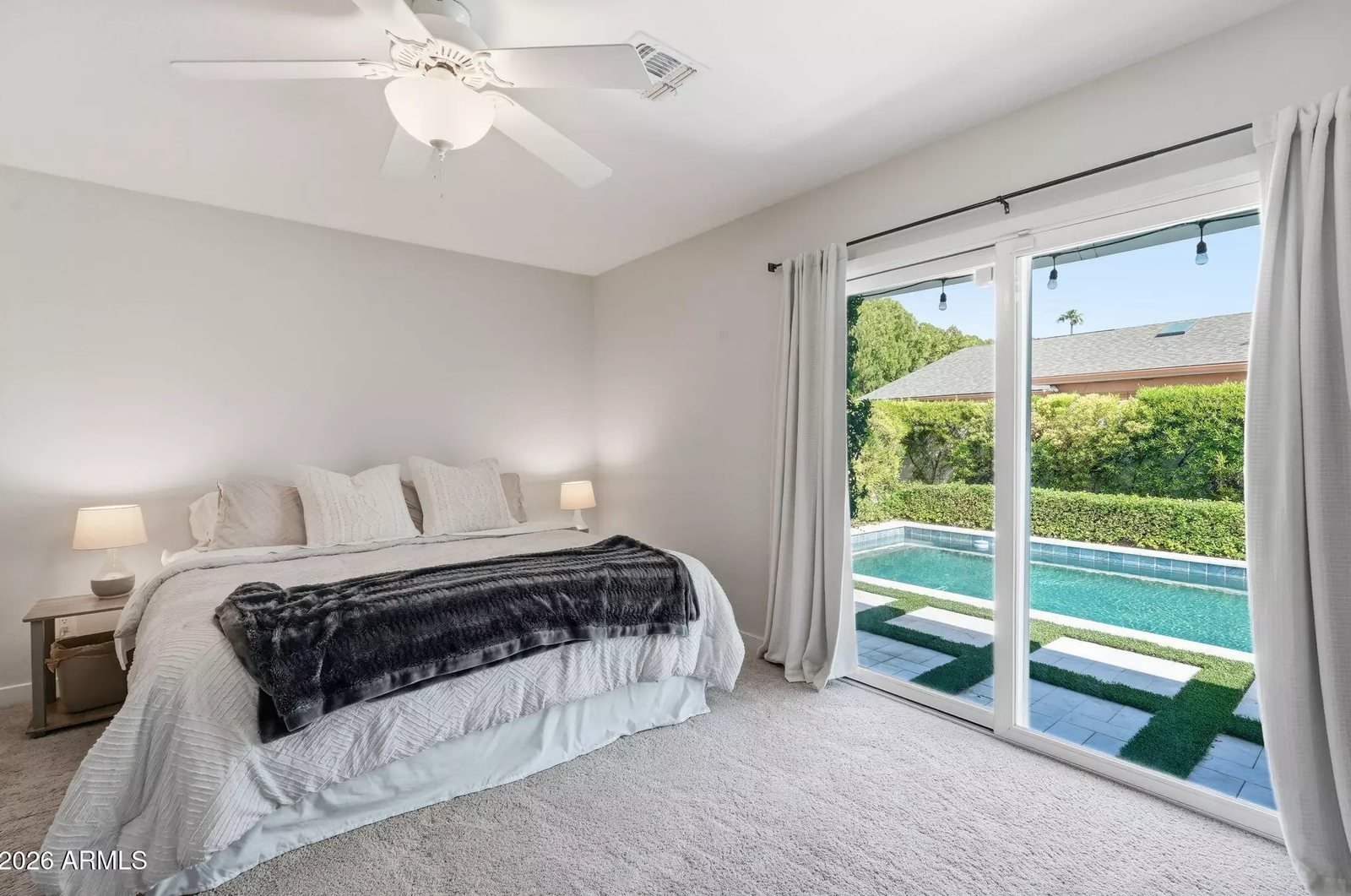 Primary bedroom with pool views in a Scottsdale, Arizona brokerage listing