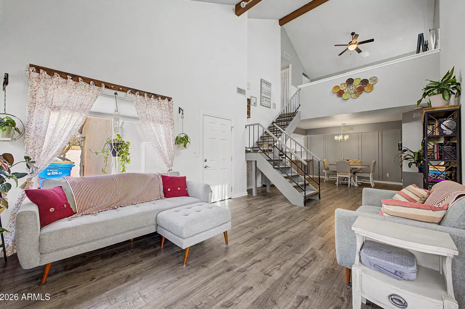 Vaulted living room with wood-look flooring in a Glendale, Arizona brokerage listing